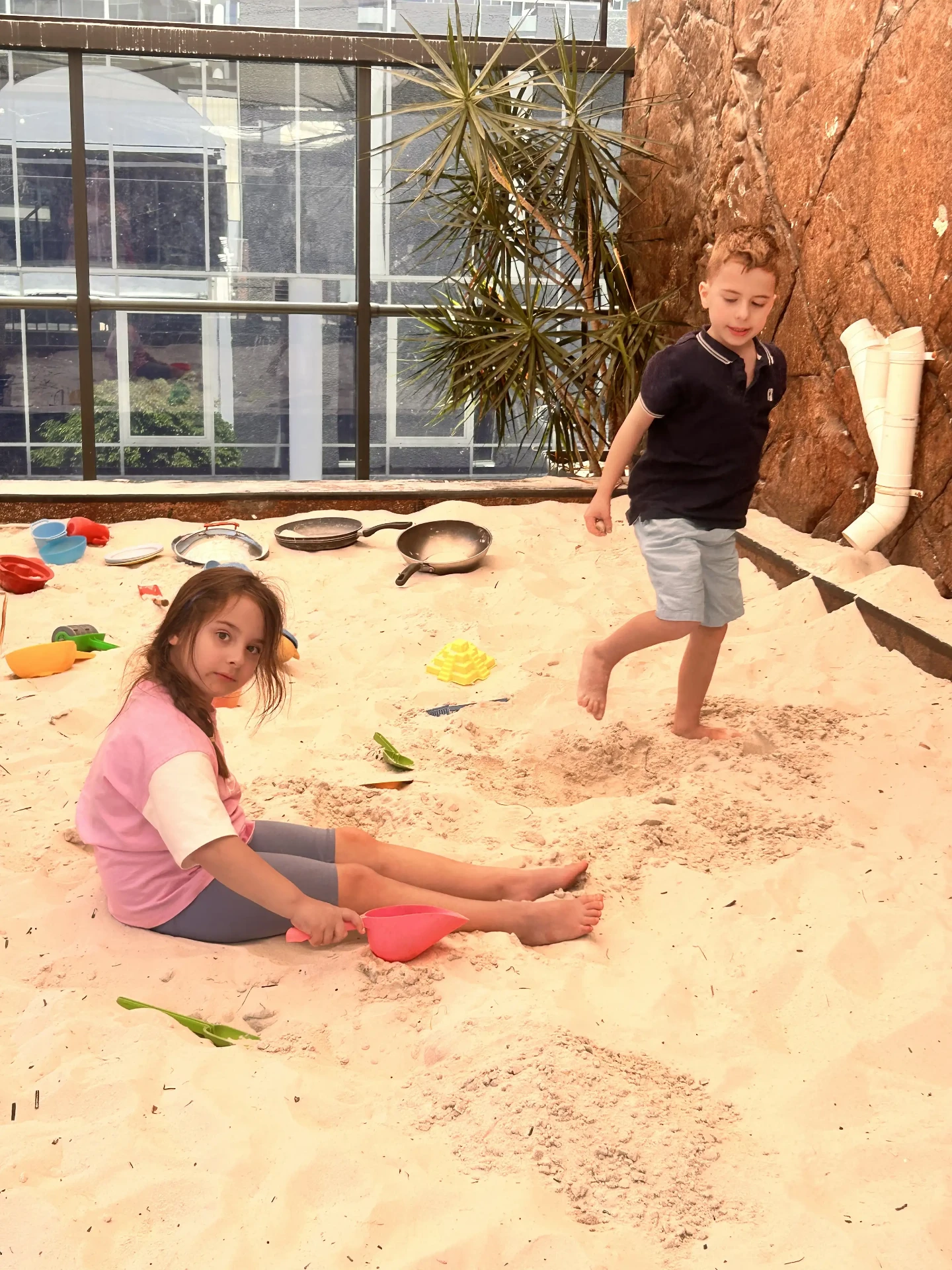 Children playing in the indoor sandpit