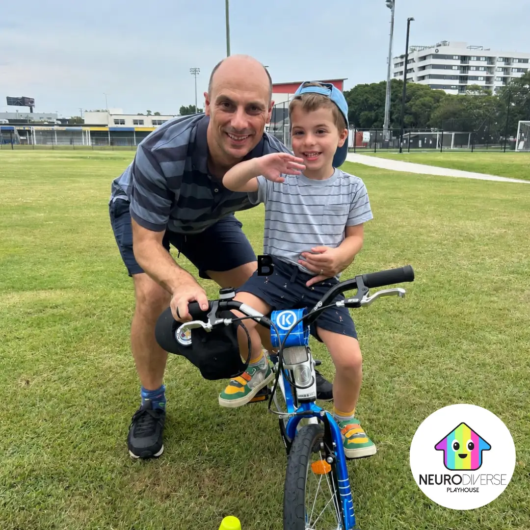 Child learning to ride a bike